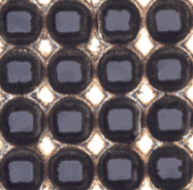 These square features were micro-drilled with a CANUNDA-PULSE reflective laser beam shaper with an Amplitude Ultrafast Laser, and their shape minimizes side overlap and material waste. Image courtesy of Cailabs