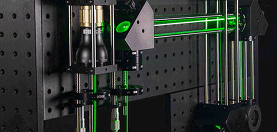 I thought beam expanders increased a laser beam's size. How can that help me to get a smaller spot?