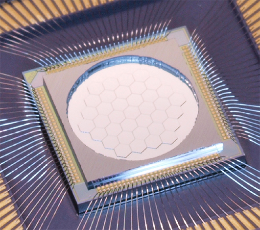 Close-up of the Iris AO 111 Actuator Deformable Mirror (Edmund Optics stock number #33-267) made of 37 hexagonal segments.